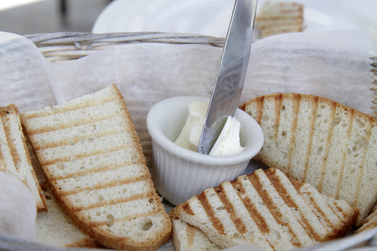 Close-up shot displays butter with toast.